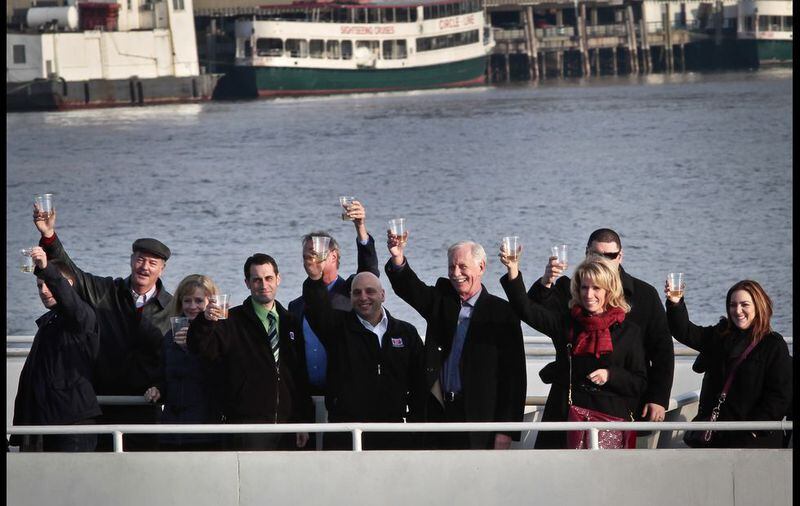 Survivors of U.S. Airways Flight 1549 with 155 passengers and crew, including Captain Chesley "Sully" Sullenberger III, who piloted safe water landing 5 years ago, join with their rescuers in a toast marking the anniversary of the event known as the "miracle on the Hudson," on Wednesday, Jan. 15, 2014 in New York. (AP Photo/Bebeto Matthews)