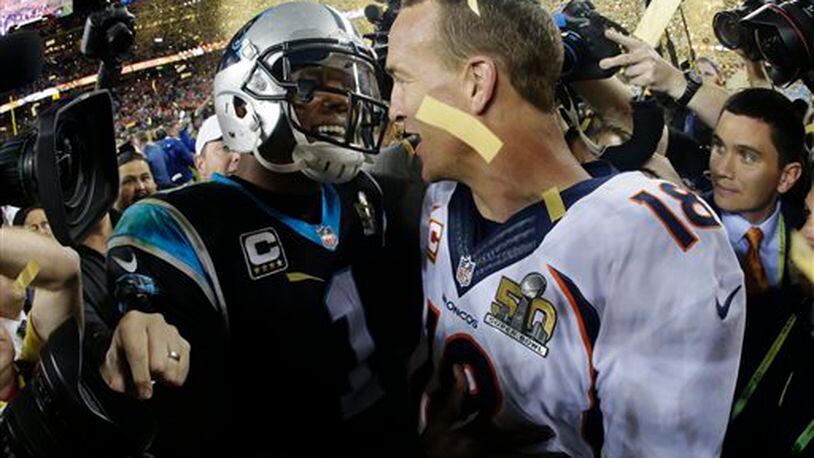 Denver Broncos� Peyton Manning, right, greets Carolina Panthers� Cam Newton (1) after the NFL Super Bowl 50 football game Sunday, Feb. 7, 2016, in Santa Clara, Calif. The Broncos won 24-10. (AP Photo/Julio Cortez)