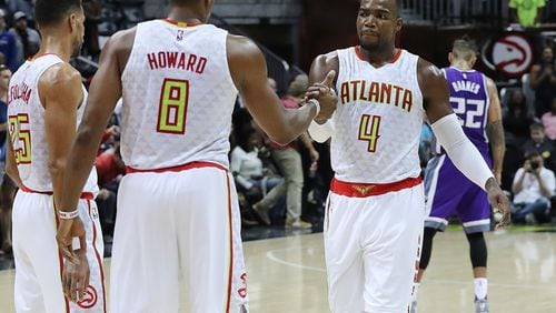 Hawks’ Dwight Howard and Paul Millsap celebrate a 106-95 victory over the Kings in an NBA basketball game on Monday, Oct. 31, 2016, in Atlanta. Curtis Compton /ccompton@ajc.com
