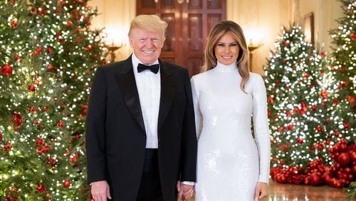 Washington, D.C. President Donald J. Trump and First Lady Melania Trump are seen in their Official Christmas Portrait in the Cross Hall of the White House.