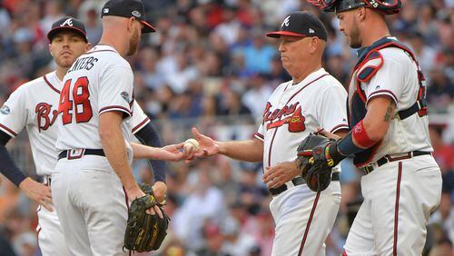October 8, 2018 - Atlanta: Atlanta Braves manager Brian Snitker gives the ball to relief pitcher Jonny Venters (48) during a pitching change in the sixth inning against the Los Angeles Dodgers in Game 4 of a National League Division Series baseball game Monday, October 8, 2018, in Atlanta. Hyosub Shin/hshin@ajc.com
