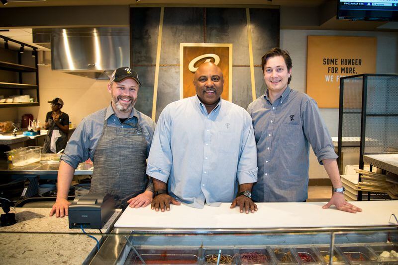 (From left to right) Chef Eddie Russel, founder John Smith, and vice president of operations Ryan Coppola in the Rize kitchen. Photo Credit- Mia Yakel.