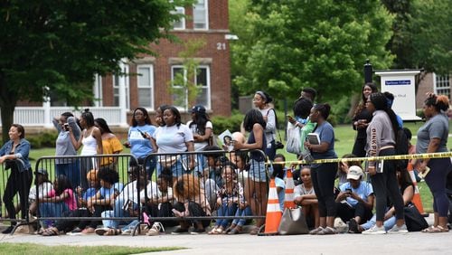 Students wait outside for former first lady Michelle Obama as she talks to students from Spelman College and Morehouse College at Giles Hall on the Spelman College campus on Saturday, May 11, 2019. The students spent this past semester studying Obama’s book “Becoming” as a foundational text of their political science class “Black Women: Developing Public Leadership Skills.” HYOSUB SHIN / HSHIN@AJC.COM