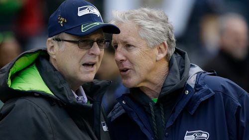 Seattle Seahawks owner Paul Allen, left, talks to head coach Pete Carroll before the 2015 NFC Championship game against the Green Bay Packers in Seattle.