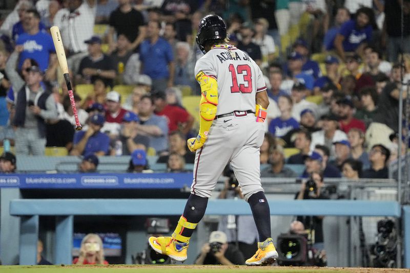 Atlanta Braves' Ronald Acuna Jr. tosses his bat after hitting a grand slam during the second inning of a baseball game against the Los Angeles Dodgers Thursday, Aug. 31, 2023, in Los Angeles. (AP Photo/Mark J. Terrill)