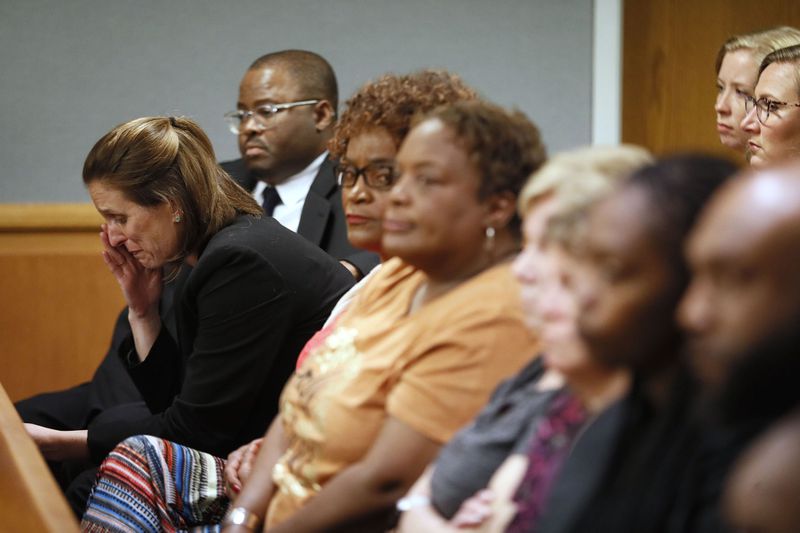 April 30, 2019 - Lawrenceville - Emily Gilbert (left) and Brad Gardner, state capital public defenders and standby council for Tiffany Moss, react to the verdict. The jury in the Tiffany Moss murder trial today sentenced her to death after they found Moss, who is representing herself, guilty of intentionally starving her 10-year-old stepdaughter Emani to death in the fall of 2013, in addition to other charges. The prosecution is asking for the death penalty.   Bob Andres / bandres@ajc.com
