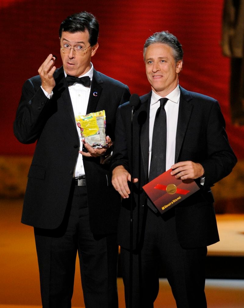 Stephen Colbert, left, and Jon Stewart make an award presentation at the 60th Primetime Emmy Awards in Los Angeles, Sunday, Sept. 21, 2008. (AP Photo/Mark J. Terrill)