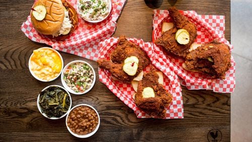 Hattie B’s Hot Chicken hot-chicken sandwich with red-skinned potato salad, and two half bird plates with pimento mac and cheese, black-eyed pea salad, Southern greens, and baked beans. CONTRIBUTED BY MIA YAKEL