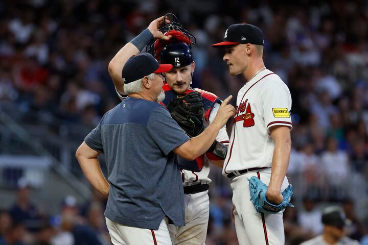 Braves pitching coach Rick Kranitz speaks with AJ Smith-Shawver as catcher Sean Murphy looks during the fourth inning at Truist Park against the Colorado Rockies on Thursday, June 15, 2023, in AtlantaMiguel Martinez / miguel.martinezjimenez@ajc.com 