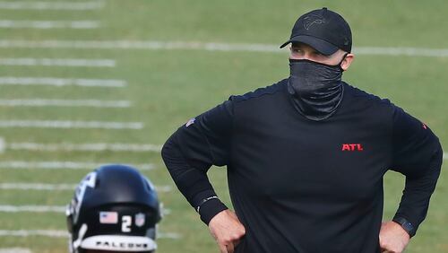 Falcons coach Dan Quinn watches over NFL football training camp on Wednesday, Aug. 19, 2020, in Flowery Branch, Ga. (Curtis Compton/Atlanta Journal-Constitution via AP, Pool)