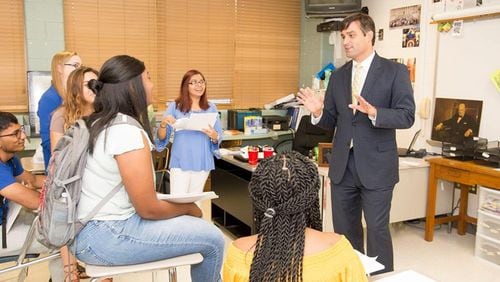 Grant Rivera, superintendent of Marietta City Schools, talks with students who now have the option of taking English for Speakers of Other Languages I to earn High School English credits. AJC file photo