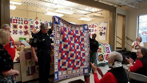 The Allatoona Quilters Guild has donated quilts for years to the Acworth Police Department so officers can give them out to children and seniors who need them. This donation was Dec. 6, 2016.