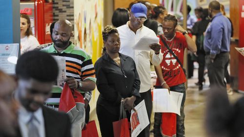 Attendees waiting for the doors to open in August at the second annual Opportunity ATL job and resource fair in East Point in Atlanta. Bob Andres / robert.andres@ajc.com
