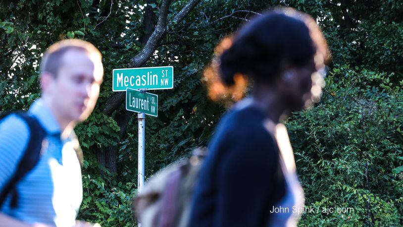Students walking on Mecaslin Street toward 14th Street in northwest Atlanta said they were approached by two men with guns, Atlanta police spokeswoman Officer Lisa Bender said. JOHN SPINK / JSPINK@AJC.COM