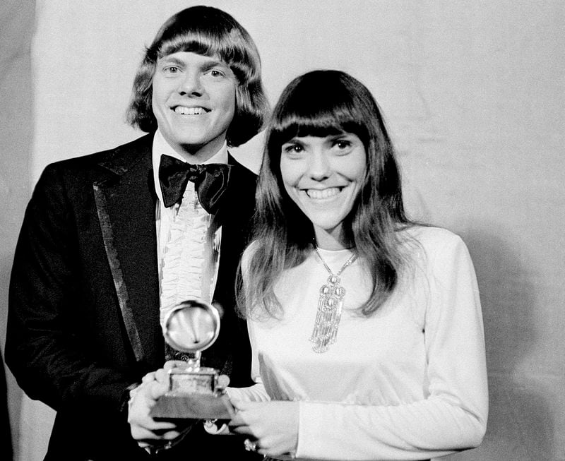 In this March 17, 1971 file photo, Richard and Karen Carpenter of The Carpenters pose with their Grammy during the 13th annual 1970 Grammy Awards in Los Angeles. The brother-sister duo was named best new artist of the year, 1970, and also won as the best contemporary duo or group vocalists for "Close to You."  In a new collection “Carpenters with the Royal Philharmonic Orchestra,” Richard Carpenter gave new string arrangements to many of the duo’s classic recordings from the late 1960s through the early 1980s, including “Close to You” and “Superstar." (AP Photo, File)
