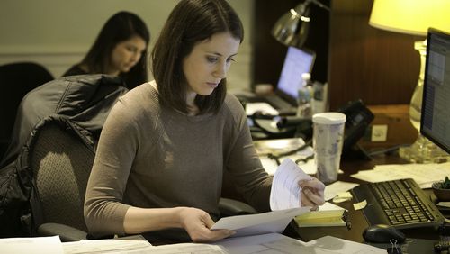 Kristen Bates (foreground) & Elizabeth King (both cq) process paperwork at the Dorsey Alston offices in Buckhead. The company has been voted the No 1 Top medium workplace in Atlanta. (Photo by Phil Skinner)