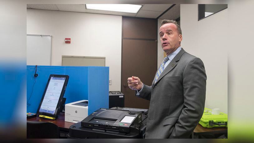 Chris Harvey, director of elections division for the Georgia Secretary of State, shows the new Georgia voting machines during a demonstration at the James H. "Sloppy" Floyd building in Atlanta, Monday, Sept. 16, 2019. (Alyssa Pointer/alyssa.pointer@ajc.com)