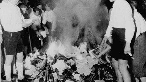 A Georgia Southern student who blasted a Latina author during a campus appearance asked the woman the purpose of her visit. Later that night, students burned the author’s book to protest its discussion of white privilege. This week, faculty are attempting to explain the purpose of the author’s visit, as well as the vile history of book burning by the Nazis, as shown in this historic news photo. These youngsters, members of the Hitler Youth, are burning books condemned as Jewish-Marxist in Salzburg, Austria, on April 30, 1938.