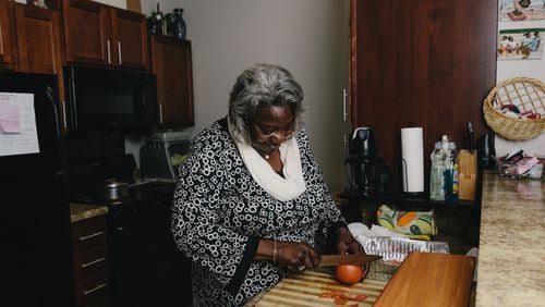 Frankie Hardman prepares a meal at her new home at  Reynoldstown Senior Residences along the eastside trail of the Atlanta BeltLine.