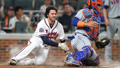 Dansby Swanson scores on a triple by Emilio Bonifacio on Wednesday. Swanson had three walks and scored twice in that game against the Mets (Curtis Compton/ccompton@ajc.com)