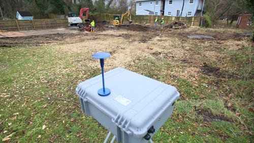 A monitor set on site to supervise the toxic levels on the ground where The Environmental Protection Agency has been moving dirt at properties in the ‘lead zone’ on Atlanta’s westside on Jan. 27, 2020, in Atlanta.