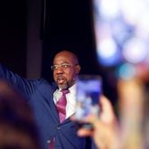 Sen. Raphael Warnock waves at supporters after winning the senate runoff election on Tuesday, December 6, 2022. (Natrice Miller/natrice.miller@ajc.com)  