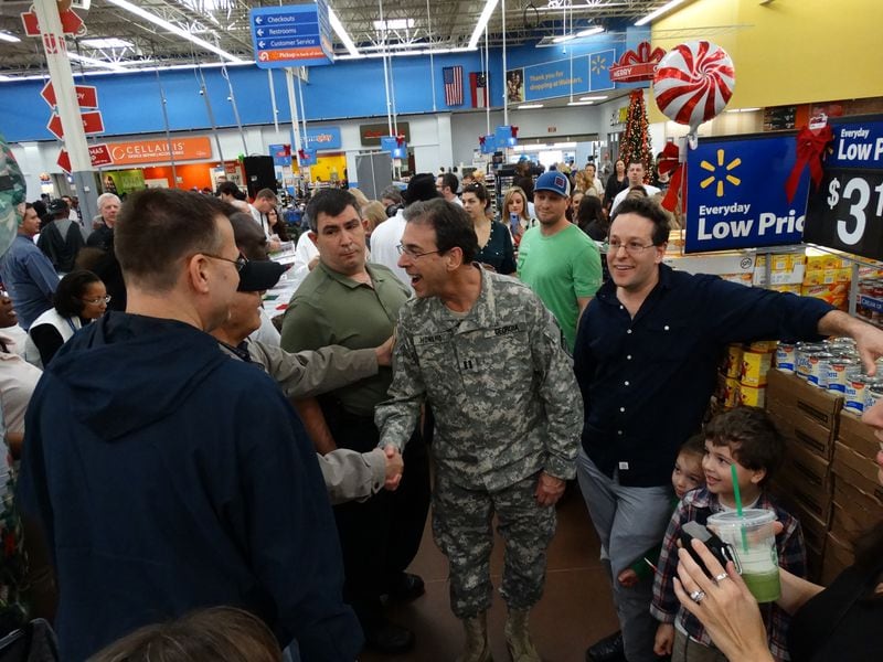 Clark Howard meeting fans at the Wal-Mart in Marietta near the Big Chicken during his toy drive for foster children on Sunday, December 13, 2015. CREDIT: Rodney Ho/ rho@ajc.com