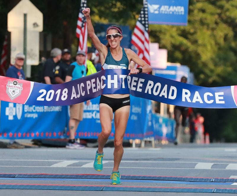 Stephanie Bruce wins the AJC Peachtree Road Race on Wednesday, July 4, 2018, in Atlanta. Curtis Compton/ccompton@ajc.com