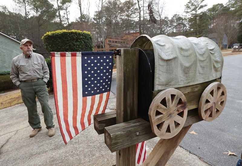 Ronny West has fashioned his mailbox into a covered wagon at his home in Kennesaw. Curtis Compton/ccompton@ajc.com