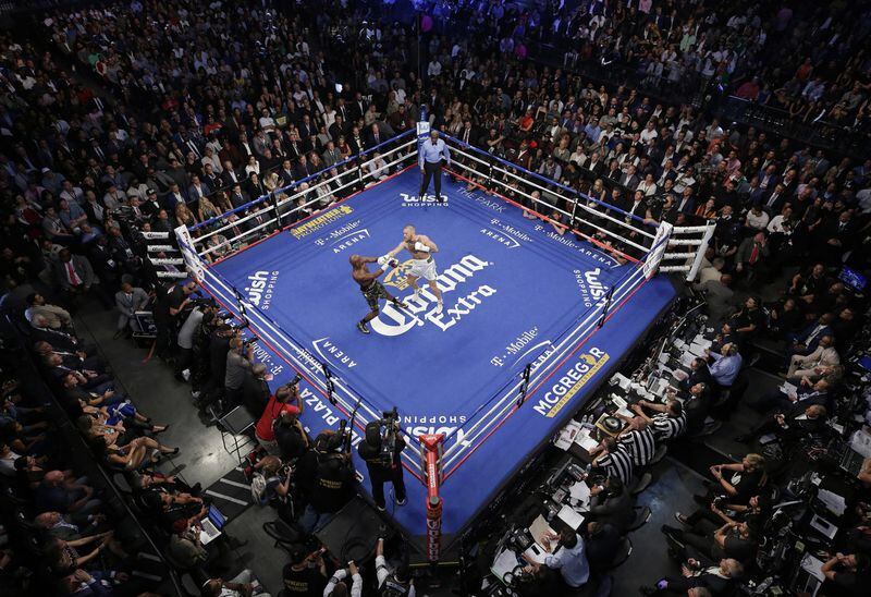 A marquee boxing match between Conor McGregor and Floyd Mayweather in Las Vegas on Aug. 27, 2017 drew thousands of VIPs. Reed and three officers in his Executive Protection Unit bought last-minute airplane tickets to Las Vegas that weekend. The former mayor did not respond when asked what city business in he was tending to before the fight. AP