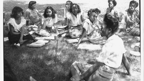 Spelman College Freshman studying outside for a History Class in 1946.