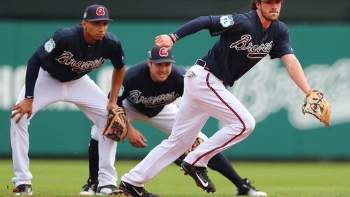 Braves shortstop Dansby Swanson (right) is expected back in the lineup Saturday after a two-week absence for back tightness. (Curtis Compton/ccompton@ajc.com)