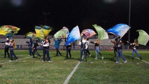 The Senior Bowl Flag Corps performs at Cherokee County schools’ fundraising football game.