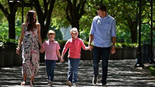 Carolina Panthers punter Andy Lee, right and his wife, Rachel, left, lost their daughter, Madelyn Elizabeth, in 2015, just eight days after she was born in Charlotte. On Wednesday, May 3, 2017 they walked outside Bank of America Stadium with sons, Adam, 5, and Ryan, 7. (Jeff Siner/Charlotte Observer/TNS)