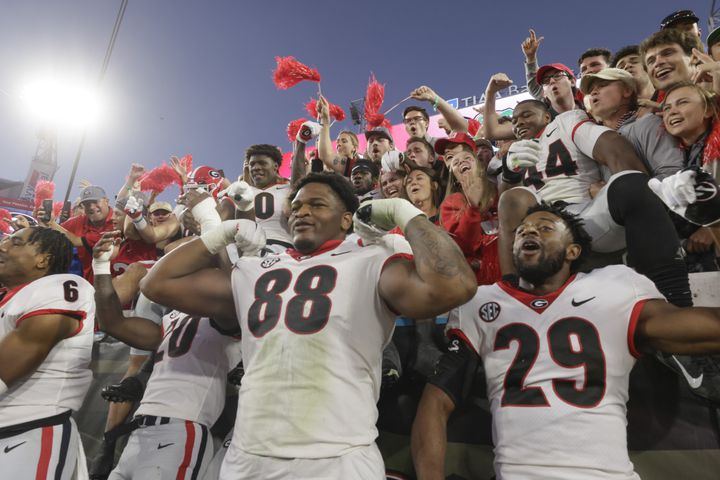 10/30/21 - Jacksonville - Georgia players celebrate with fans after the annual NCCA  Georgia vs Florida game at TIAA Bank Field in Jacksonville. Georgia won 34-7.  Bob Andres / bandres@ajc.com