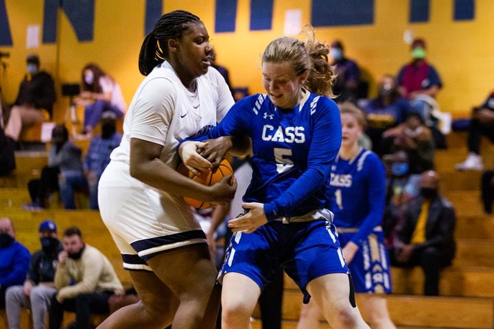 Adrieanna Browniee (left), center for South Dekalb High School, and past Haley Johnson (right), guard for Cass High School, struggle for the ball during the South Dekalb vs. Cass girls basketball playoff game on Friday, February 26, 2021, at South Dekalb High School in Decatur, Georgia. South Dekalb defeated Cass 72-46. CHRISTINA MATACOTTA FOR THE ATLANTA JOURNAL-CONSTITUTION