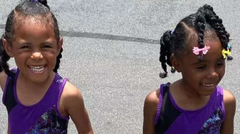 One of the twins was found dead inside the burned-down apartment, while the other was taken to a hospital with fire-related injuries, authorities said.