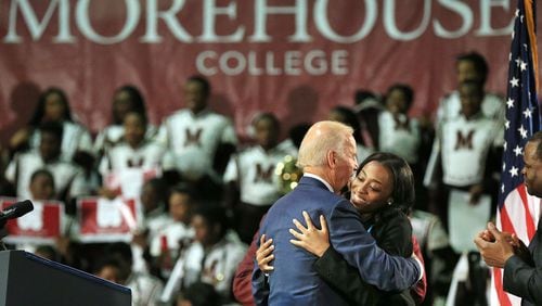 Then-Vice President Joe Biden gets a hug from VenKayla Haynes after his speech at Morehouse College during a three-college tour to mobilize students to take action to prevent sexual assault on campuses in 2015. (Curtis Compton / AJC file photo)
