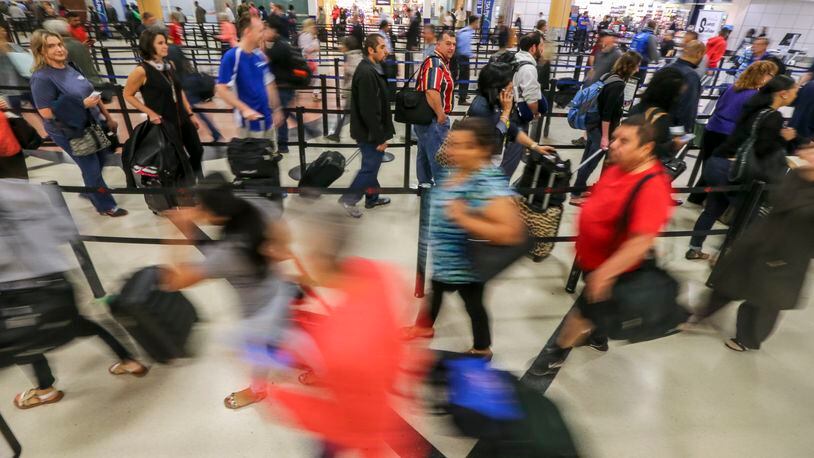 SECONDARY PHOTO - May 16, 2016 Atlanta: Security screening lines up to an hour long or more snaked through the terminal and around baggage claim carousels at Hartsfield-Jackson International Airport early Monday morning, May 16, 2016. Lines for Transportation Security Administration checkpoints have been particularly long for more than a week amid the closure of the Terminal South checkpoint for a redesign of two security lanes aimed at speeding screening. The checkpoint is expected to reopen May 24. In the domestic terminal, the Main checkpoint and Terminal North checkpoint are now handling the huge volumes of passengers that come to the airport. Monday mornings are often the busiest time of the week. JOHN SPINK / JSPINK@AJC.COM