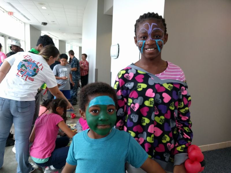 David and Kendra Assonken amused themselves at the Columbus Civic Center, where their family took refuge from Hurricane Irma, by painting their faces.