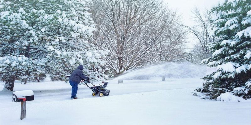 A man snowblows his driveway. A polar vortex has encased parts of the Midwest and northern plains in frigid temperatures, but that didn't stop 82-year-old Marlene Downing from snowblowing her and her neighbors driveways.