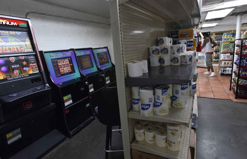 A convenience store in the Pittsburgh neighborhood has four coin-operated amusement machines in the back of the store. The Georgia Lottery Commission has 19 inspectors and agreements with law enforcement agencies to regulate 22,000 machines in about 5,000 locations throughout the state. HYOSUB SHIN / HSHIN@AJC.COM
