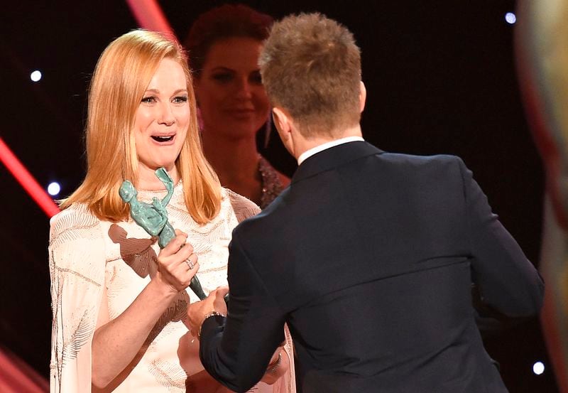 Laura Linney, left, presents Sam Rockwell with the award for outstanding performance by a male actor in a supporting role for "Three Billboards Outside Ebbing, Missouri" at the 24th annual Screen Actors Guild Awards at the Shrine Auditorium & Expo Hall on Sunday, Jan. 21, 2018, in Los Angeles. (Photo by Vince Bucci/Invision/AP)