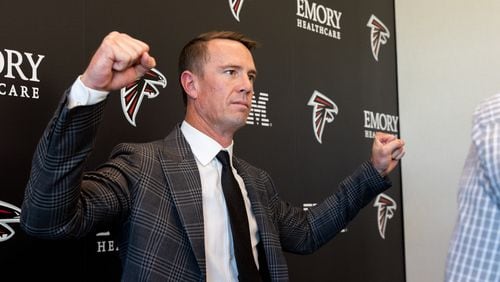 Former Falcons quarterback Matt Ryan strikes a pose after announcing his retirement at a press conference at the Falcons practice facility in Flowery Branch on Monday, April 22, 2024. (Arvin Temkar / arvin.temkar@ajc.com)