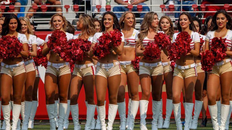 San Francisco 49ers cheerleader takes a knee during national anthem