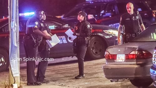 Atlanta police officers investigate a shooting Monday morning at the intersection of Atlanta Avenue and Hank Aaron Drive.