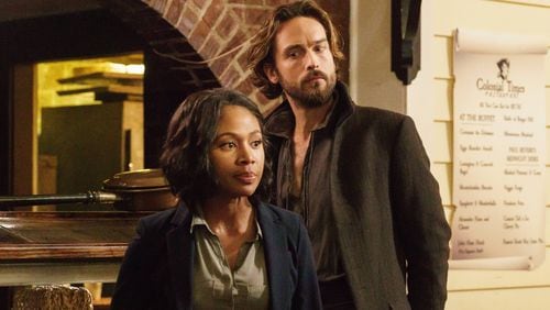SLEEPY HOLLOW: Ichabod Crane (Tom Mison, L) and Abbie (Nicole Beharie, R) try to come up with a plan in the "I, Witness" season two premiere episode of SLEEPY HOLLOW airing Monday, Oct. 1 (9:00-10:00 PM ET/PT) on FOX. ©2014 Fox Broadcasting Co. CR: Tina Rowden/FOX