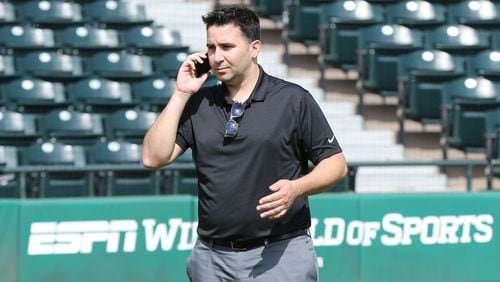 Braves GM Alex Anthopoulos works the phones during spring training this year.     Curtis Compton/ccompton@ajc.com