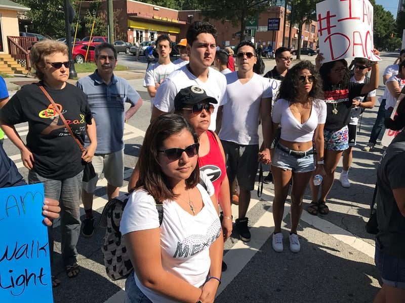 Mariana Aguilar, front and center, attended Monday’s rally in downtown Atlanta in support of the Deferred Action for Childhood Arrivals program, or DACA. A DACA recipient, Aguilar said: “We should all get the opportunity to work. We are not doing anything bad here. We are helping out the economy.”