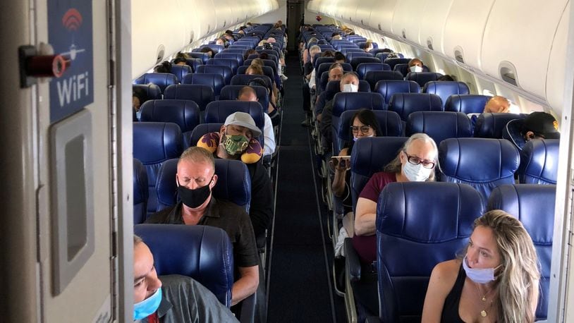 Masked passengers fill a Southwest Airlines flight from Burbank to Las Vegas. So far this year, nearly 1 in 6 flight attendants nationwide has had a physical experience with an unruly passenger, mostly involving people who were drunk and obstinate about face mask rules. (Christopher Reynolds/Los Angeles Times/TNS)